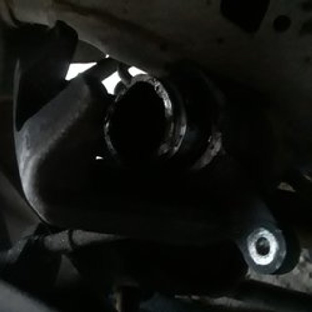 Close-up of undercar mechanical parts during auto repair