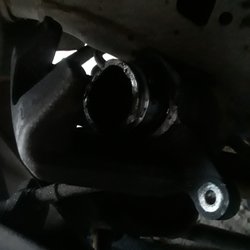 Dark close-up of undercar mechanical parts